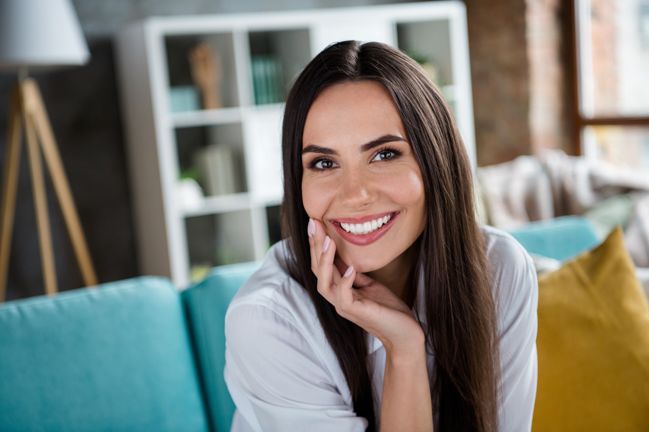 Portrait of good mood toothy smiling sitting divan in comfy dormitory free time vacation holiday