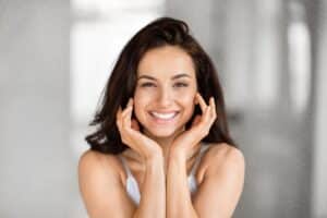 Woman with healthy smile after wisdom teeth removal in Pasadena, CA